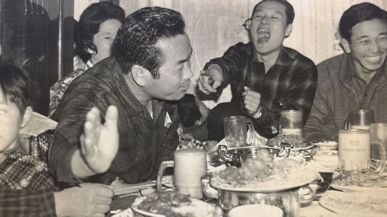 a group of people sitting together for a meal